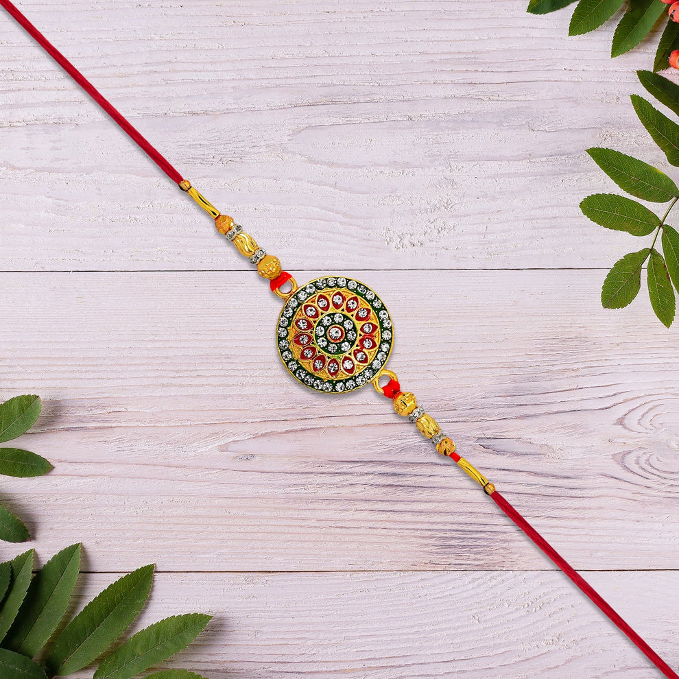 Decorative string with circular bead design on a wooden surface with leaves