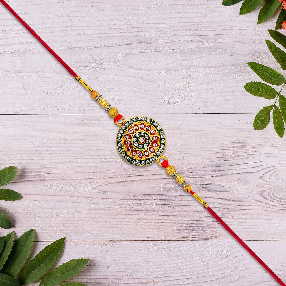 Decorative string with circular bead design on a wooden surface with leaves