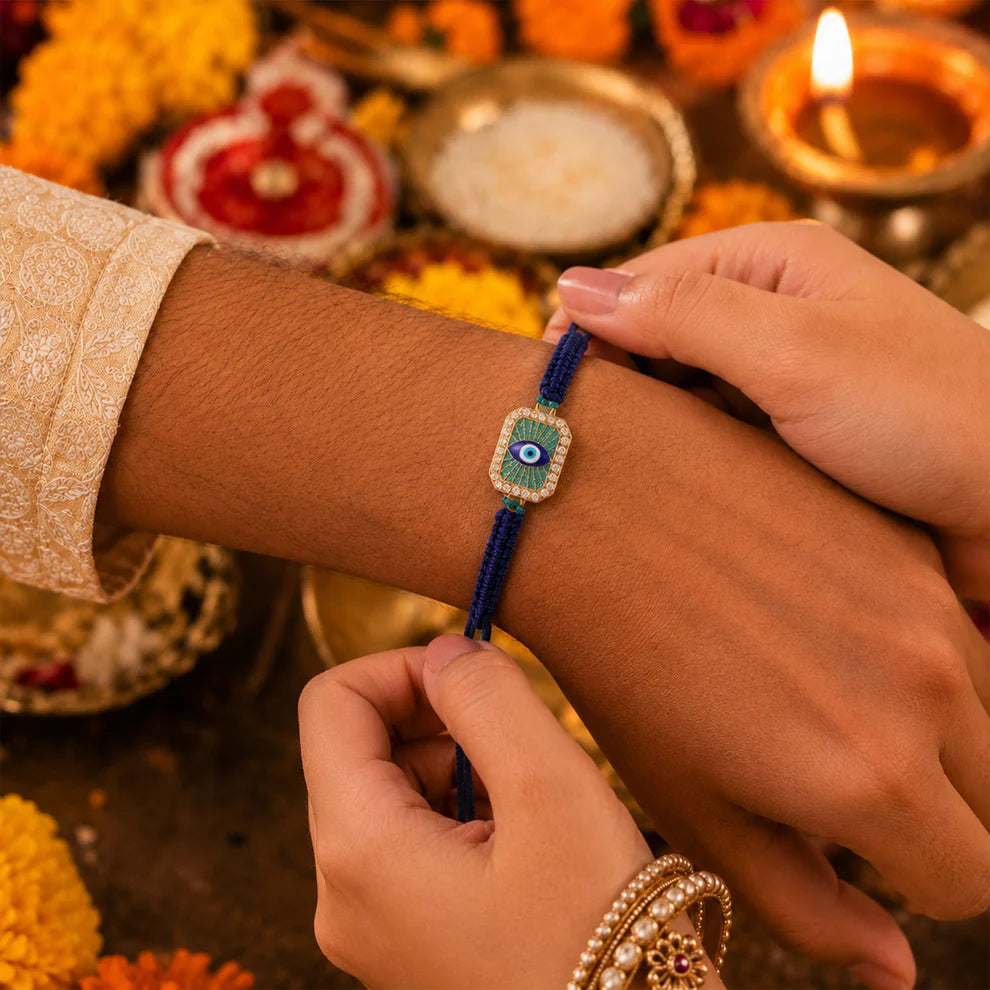 Person wearing a blue beaded bracelet with decorative background
