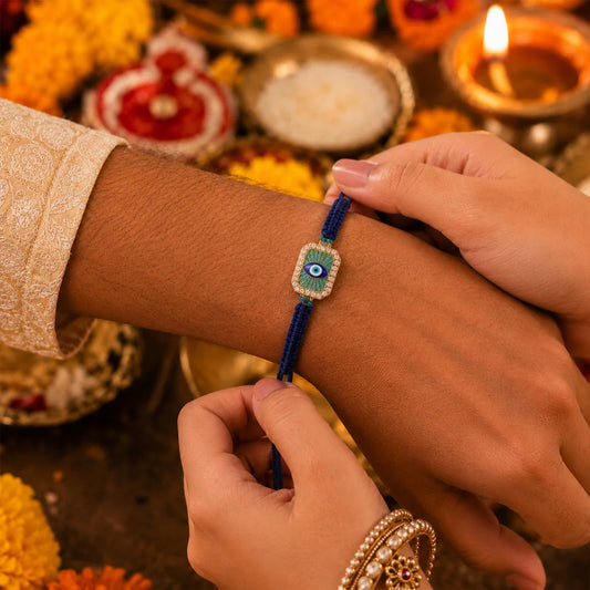 Person wearing a blue beaded bracelet with decorative background